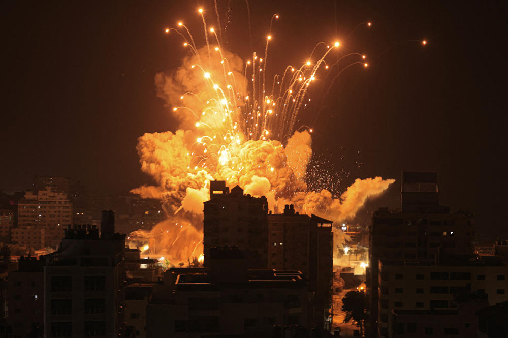 A missile explodes in Gaza City during an Israeli air strike.