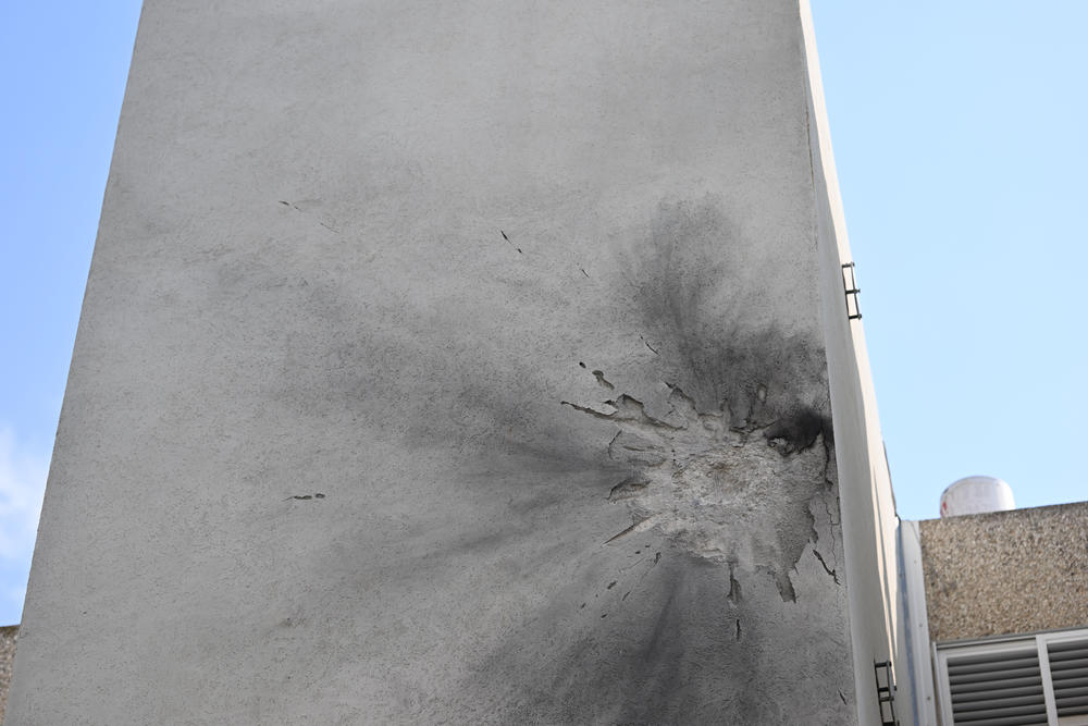 A street and apartment building that was hit by a rocket from Gaza on Tuesday in Sderot, Israel.