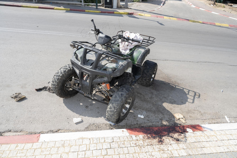 An abandoned quad bike caked with blood in Sderot, Israel.