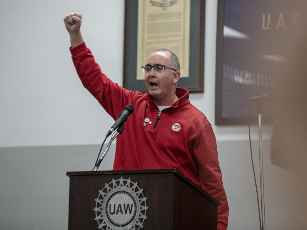 UAW President Shawn Fain joins union members at a rally at the UAW Local 551 hall on the South Side in Chicago on Oct. 7, 2023. Fain said on Friday the union will now be ready to expand its strike at any time, calling it a 
