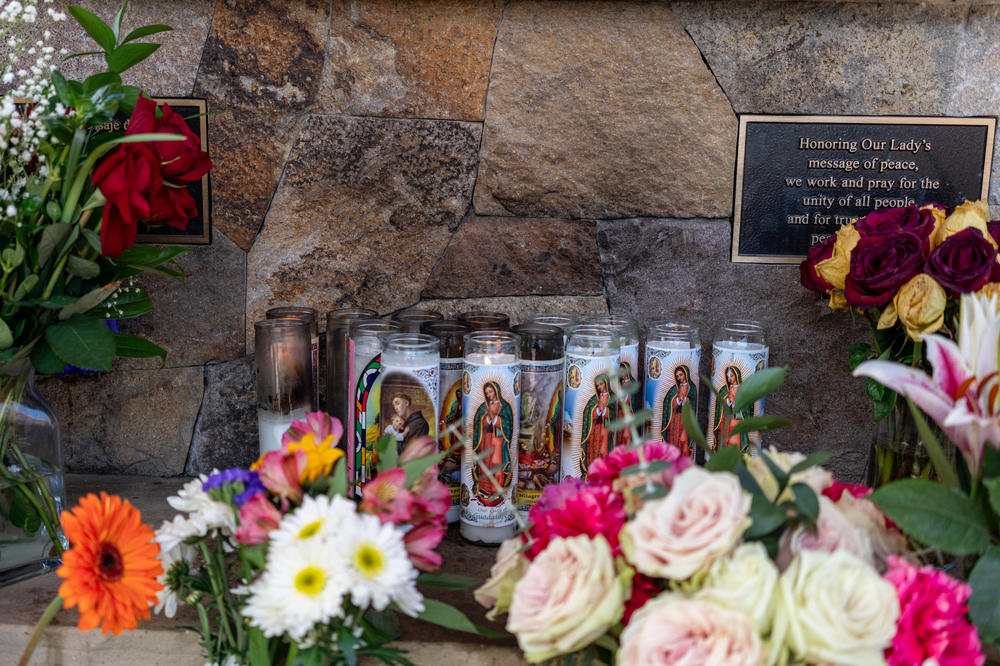 Candles of the Mexican Virgin of Guadalupe sit outside the church where Kevin's Mass took place on June 17, 2023.