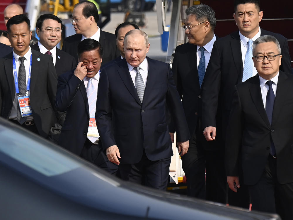 Russia's President Vladimir Putin, center, arrives at Beijing Capital International Airport to attend the third Belt and Road Forum in Beijing, Tuesday, Oct. 17, 2023.