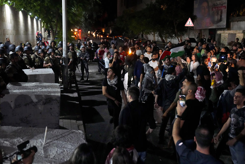 Tues., Oct. 17: Demonstrators throw stones towards the French embassy during a protest in solidarity with the Palestinian people in Gaza, in Beirut, Lebanon.