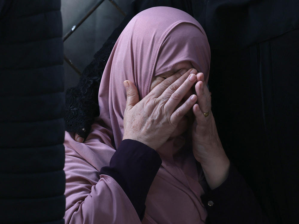 A Palestinian woman mourns after an Israeli airstrike at the Rafah refugee camp, in the southern Gaza Strip on Tuesday.