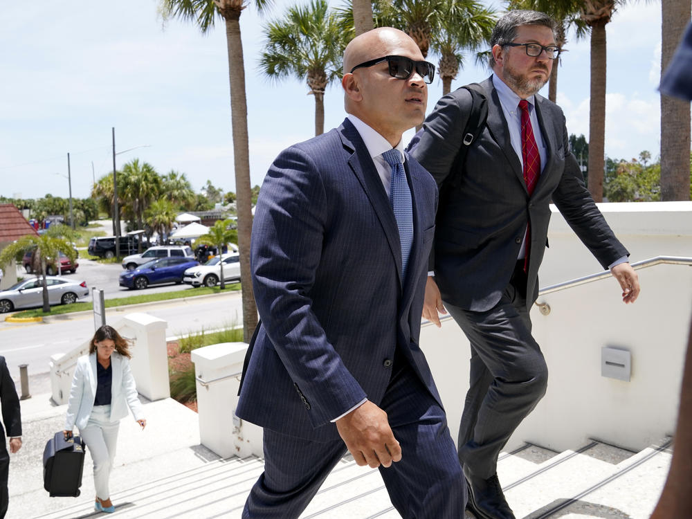 Walt Nauta (left), an aide to former President Donald Trump, arrives with defense attorney Stanley Woodward for a July hearing in federal court in Fort Pierce, Fla.