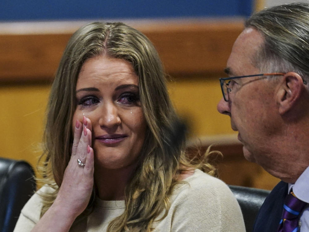 Jenna Ellis speaks with her attorney Franklin Hogue in an Atlanta court on Tuesday after pleading guilty to a felony count of aiding and abetting false statements and writing.
