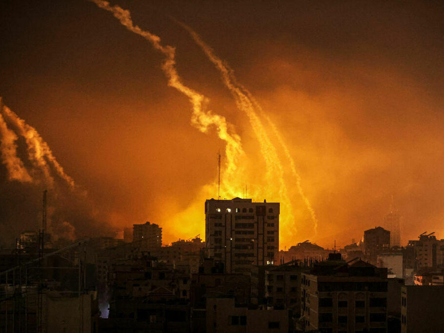 Smoke rises and billows in the Gaza Strip as the Israeli army conducts air attacks early Saturday local time.