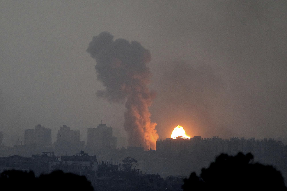 Fire and smoke rise following an Israeli airstrike in the Gaza Strip, as seen from southern Israel, Saturday.