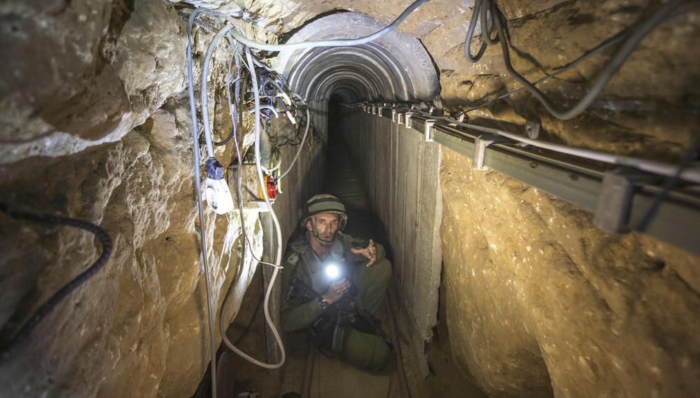 An Israeli army officer gives journalists a tour in 2014 of a tunnel allegedly used by Palestinian militants for cross-border attacks, at the Israel-Gaza Border. Hamas has been building the tunnels for the past two decades.