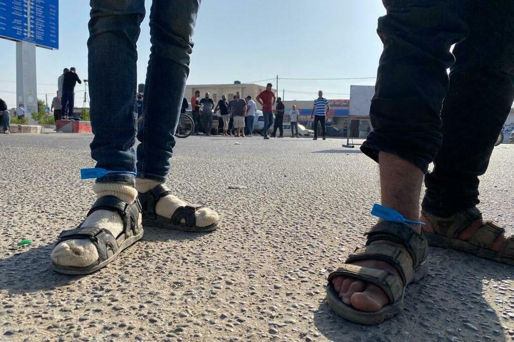 Gaza laborers working in Israel when the war began were rounded up and detained by Israeli authorities, and on Friday were sent back to Gaza with ankle tags numbering them.