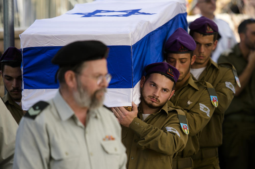 Friends from the army unit carry the coffin of soldier, Adi Leon, killed in a ground opreation in the Gaza Strip, on Wednesday in Modi'in-Maccabim-Re'ut, Israel. On October 31, the Israeli government reported the deaths of 13 soldiers who it said were killed during ground operations in the Gaza Strip, as part of its fight against Hamas.