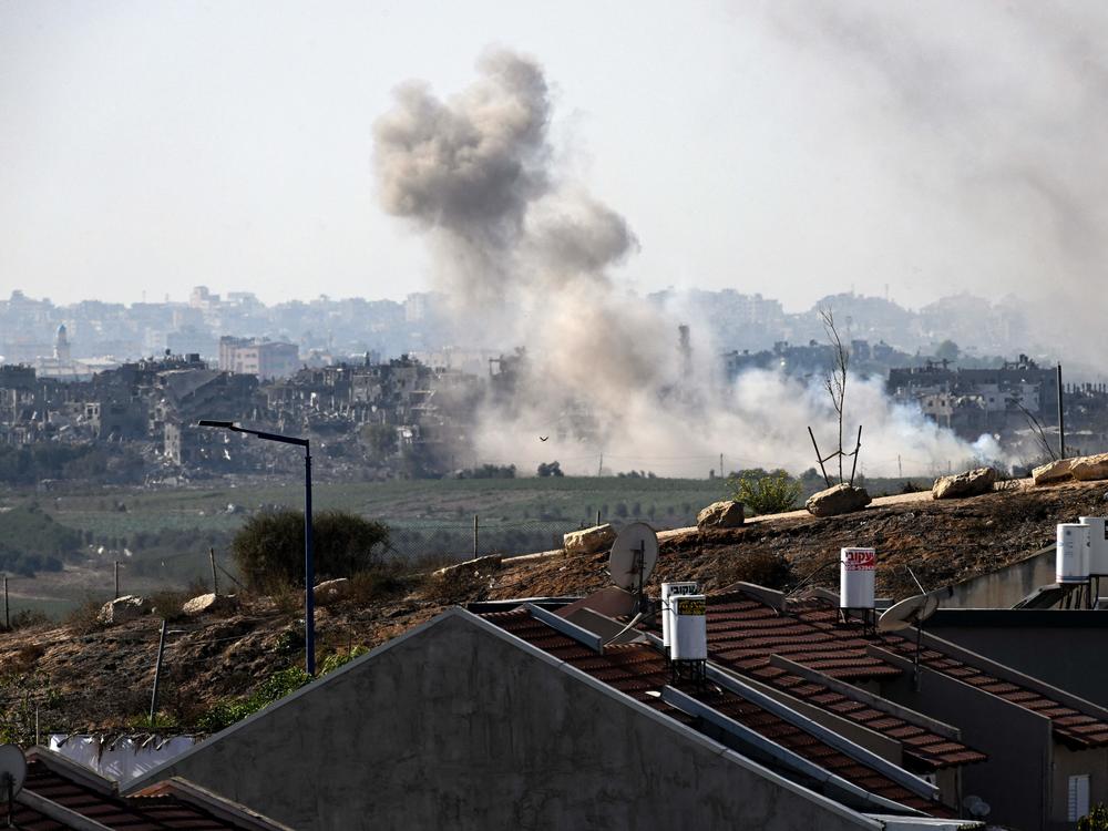 A picture taken from the southern Israeli border city of Sderot shows smoke rising above buildings in the Gaza Strip during an Israeli military operation on Nov. 4, 2023.
