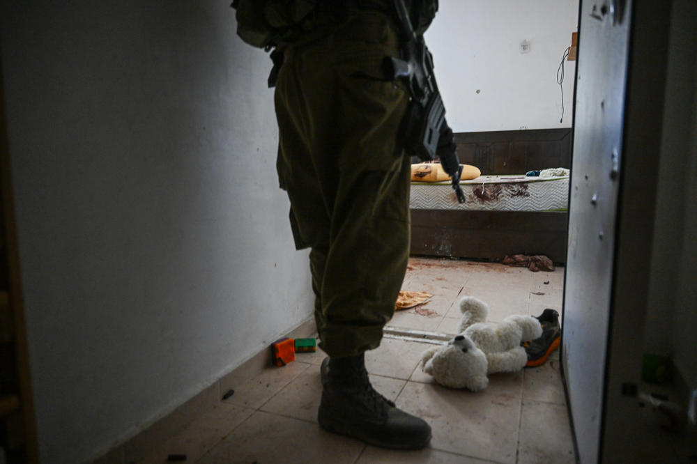 A teddy bear is seen left on the ground near the bomb shelter of a kibbutz home attacked by Hamas on Oct 7th, near the border with Gaza, on Wednesday in Holit, Israel.