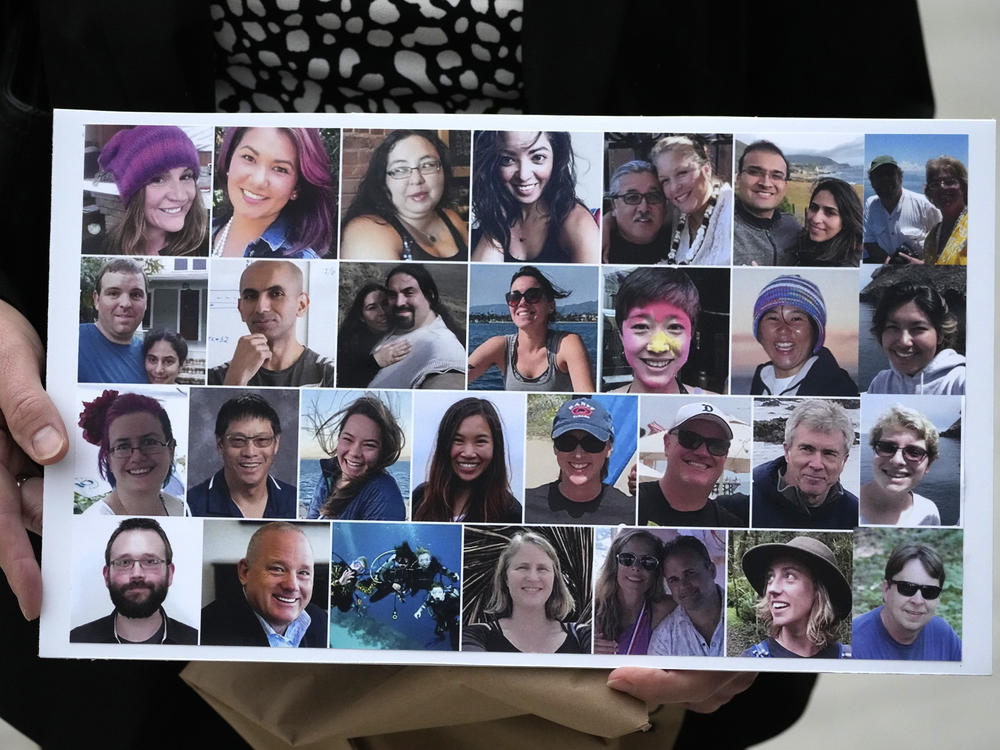 A photo collage of the 34 victims of the Sept. 2, 2019 fire aboard the dive boat, Conception, at Santa Cruz Island, is held by a family member arriving at federal court in Los Angeles, Wednesday, Oct. 25, 2023.