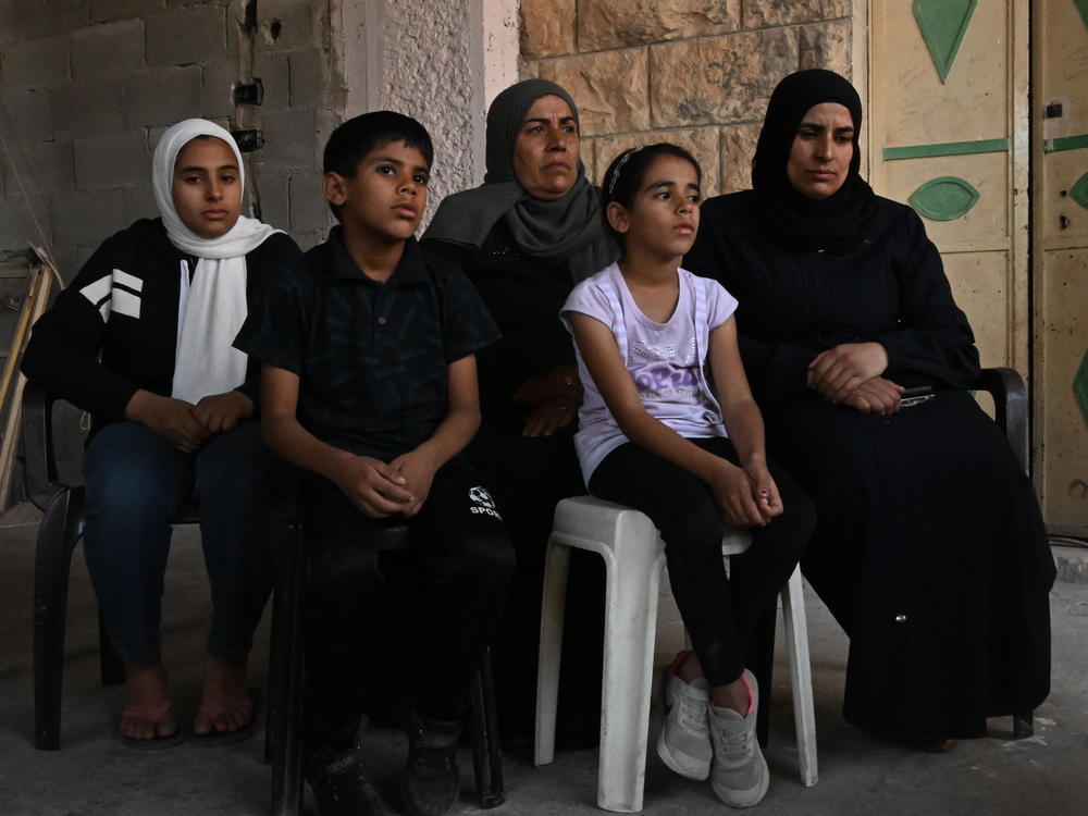 The family of Bilal Muhammed Saleh outside their home in  As-Sawiya, occupied West Bank on Oct. 31, 2023.