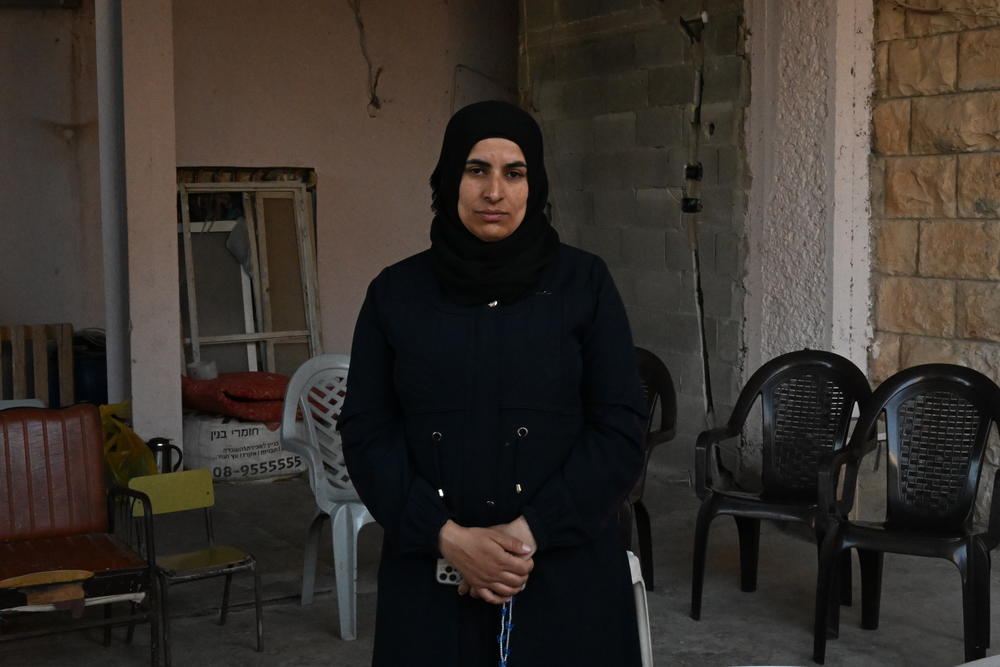 Ikhlas Muhammed Saleh, Bilal's wife, outside their home in the village of As-Sawiya, occupied West Bank.