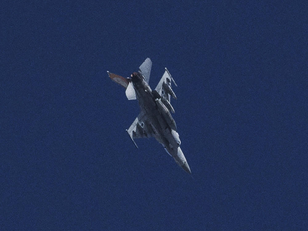 An Israeli jet fighter flies near the Gaza Strip, as seen from southern Israel, Friday, Nov. 10, 2023.