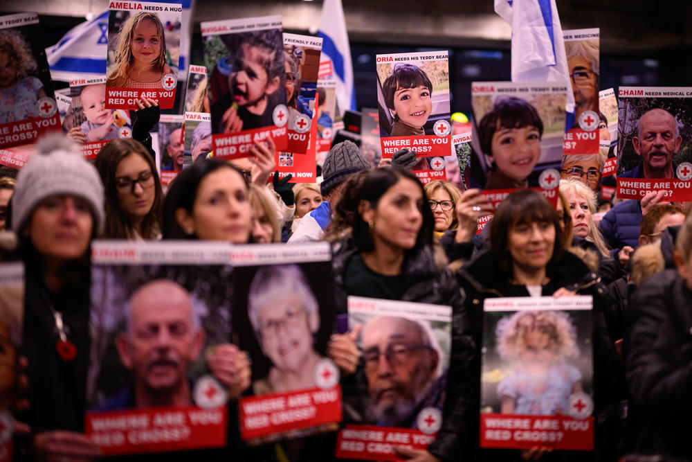 Protesters hold up placards featuring the faces of some of the people believed to be held hostage by Hamas in Gaza, during a rally on Thursday in London.