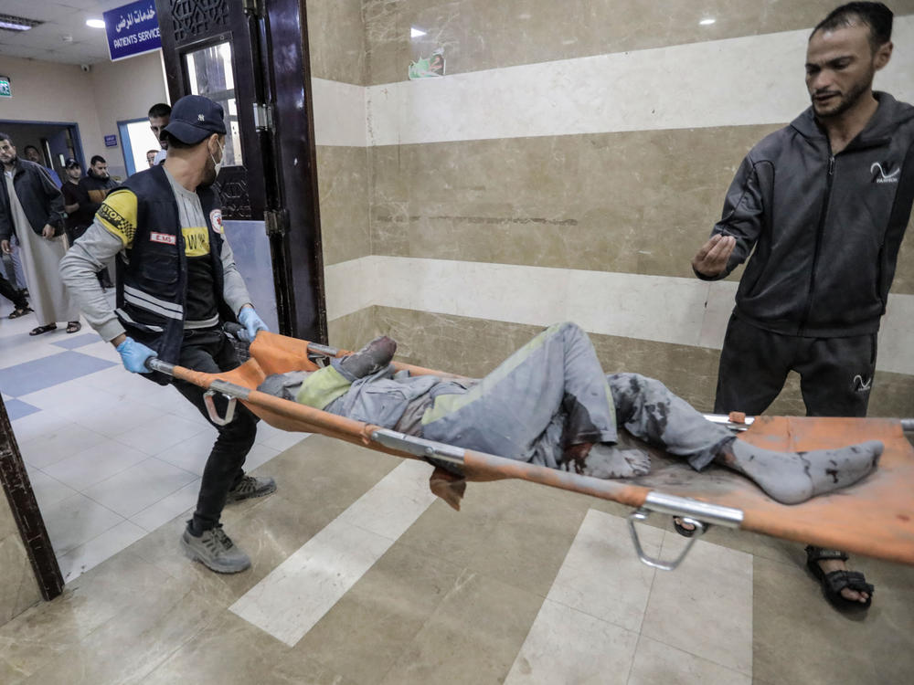 Palestinians injured in Israeli raids arrive at Nasser Medical Hospital on Tuesday in Khan Younis, Gaza.