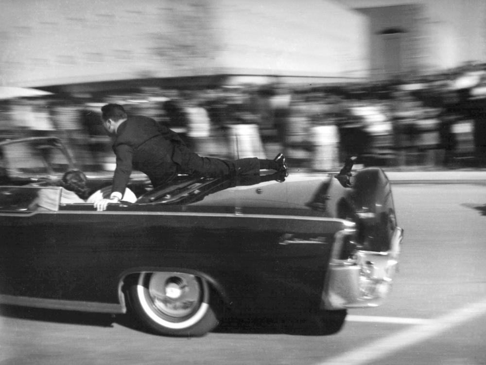 Secret Service agent Clint Hill rides on the back of the presidential limousine moments after President John F. Kennedy was shot on Nov. 22, 1963.