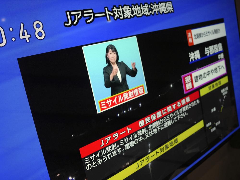 A TV shows a J-Alert or National Early Warning System to Japanese residents on Tuesday in Tokyo. North Korea launched a rocket in its third attempt to put a spy satellite into orbit, according to South Korea's military.