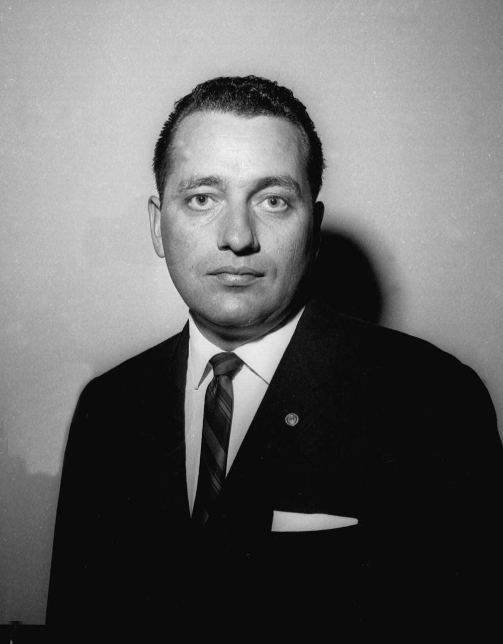 Hill poses for a photo on Dec. 3, 1963. On his lapel he wears a special pin that was presented to him for bravery in trying to protect the president and first lady during the assassination in Dallas.