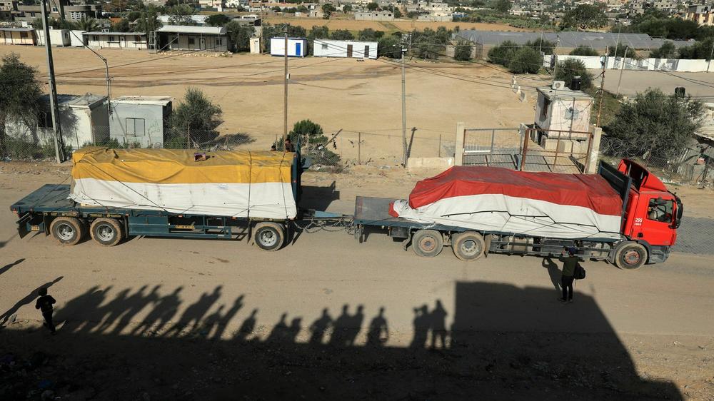 A truck carrying humanitarian aid enters the Gaza Strip via the Rafah crossing with Egypt, hours after the start of a four-day truce in battles between Israel and Palestinian Hamas militants on Friday.