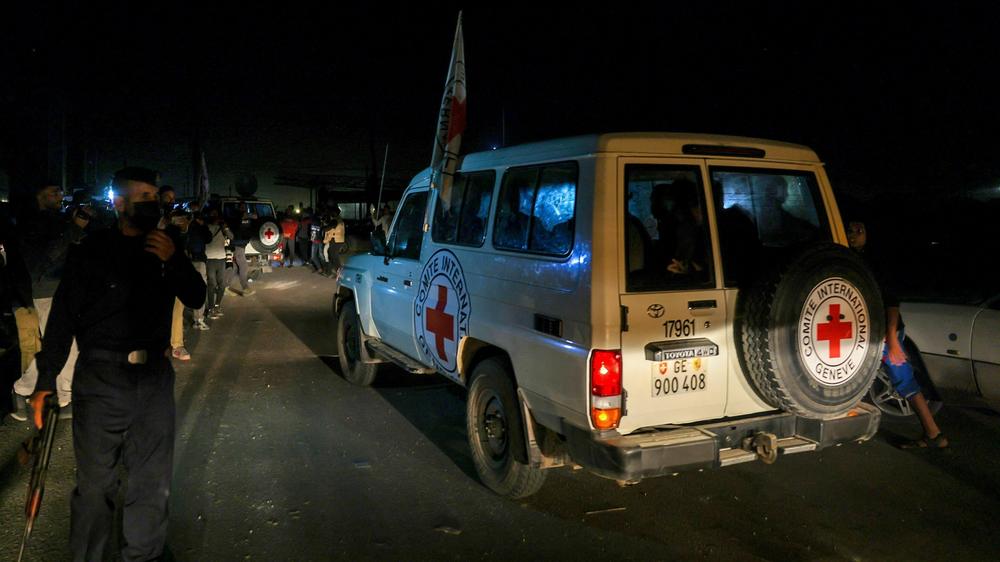 International Red Cross vehicles reportedly carrying Israeli hostages released by Hamas cross the Rafah border point in the Gaza Strip on the way to Egypt on Friday.