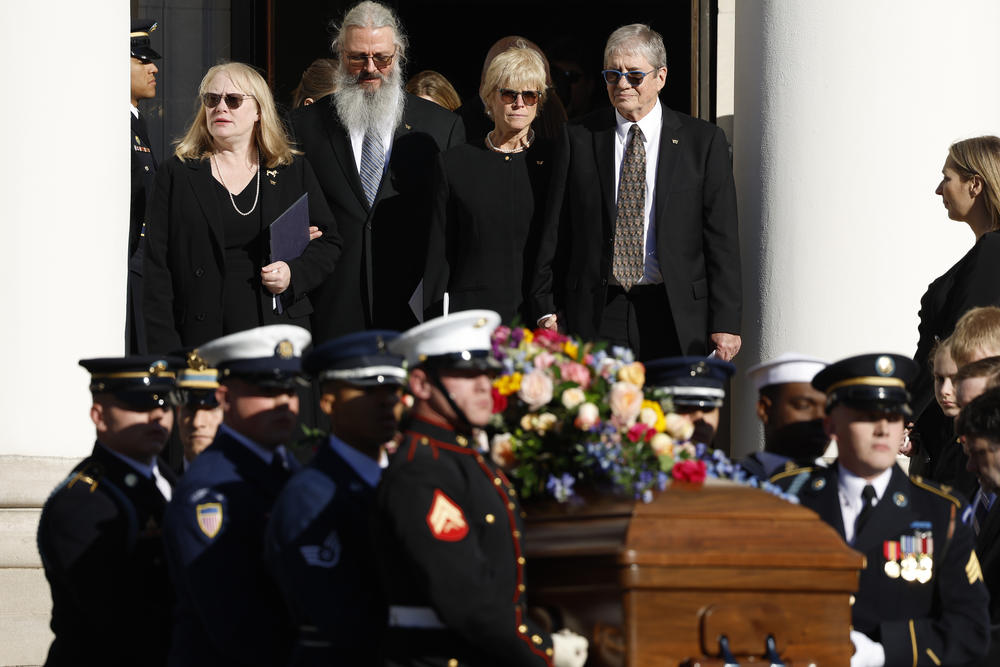 Members of former first lady Rosalynn Carter's family look on as her casket is carried out of Glenn Memorial United Methodist Church following her tribute service on Nov. 28, 2023 in Atlanta, Ga.