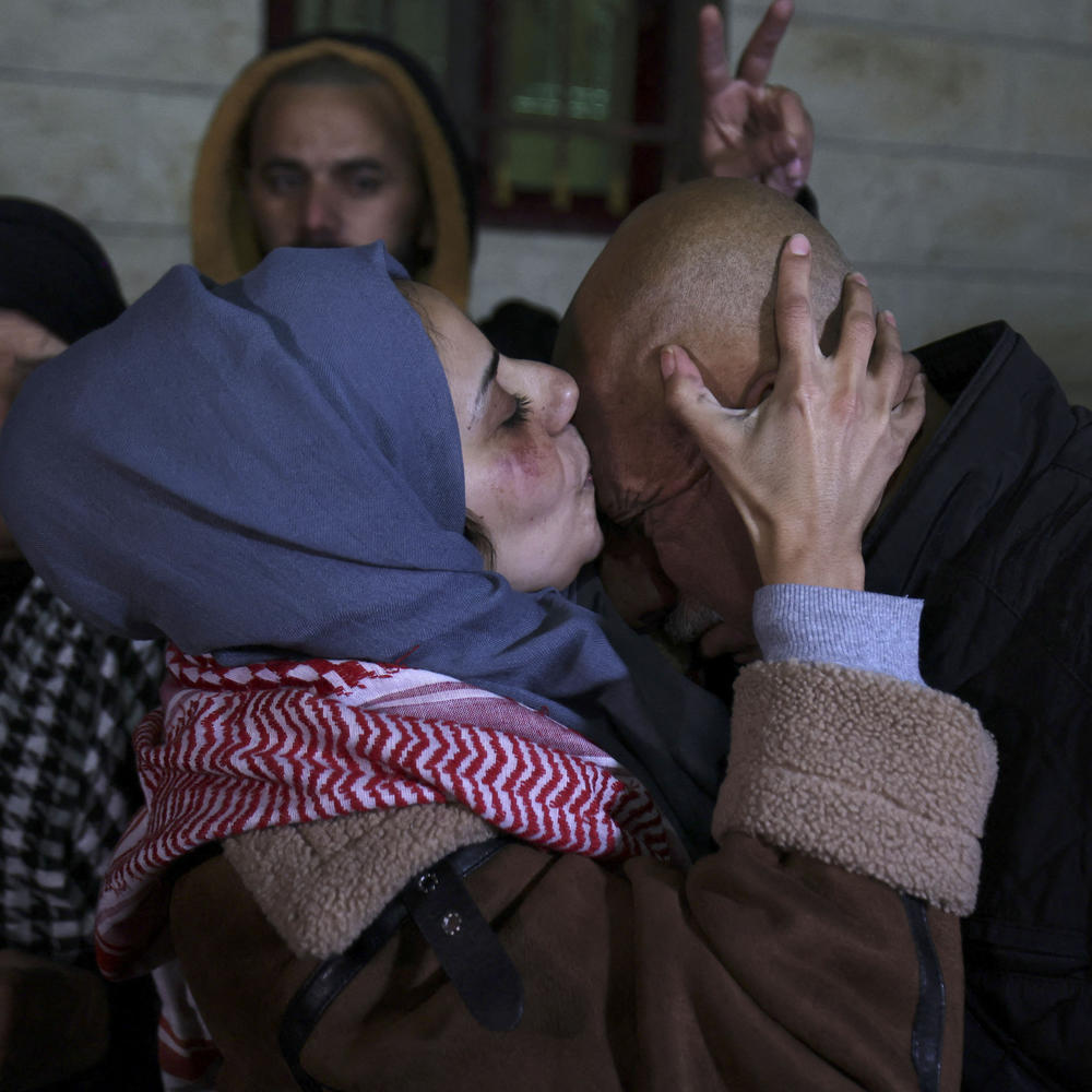 Newly freed Palestinian prisoner Lamees Abu Arqub kisses her father after Palestinians were freed from Israeli jails in exchange for Hamas hostages held in Gaza, in the village of Dura in the occupied West Bank on Tuesday.