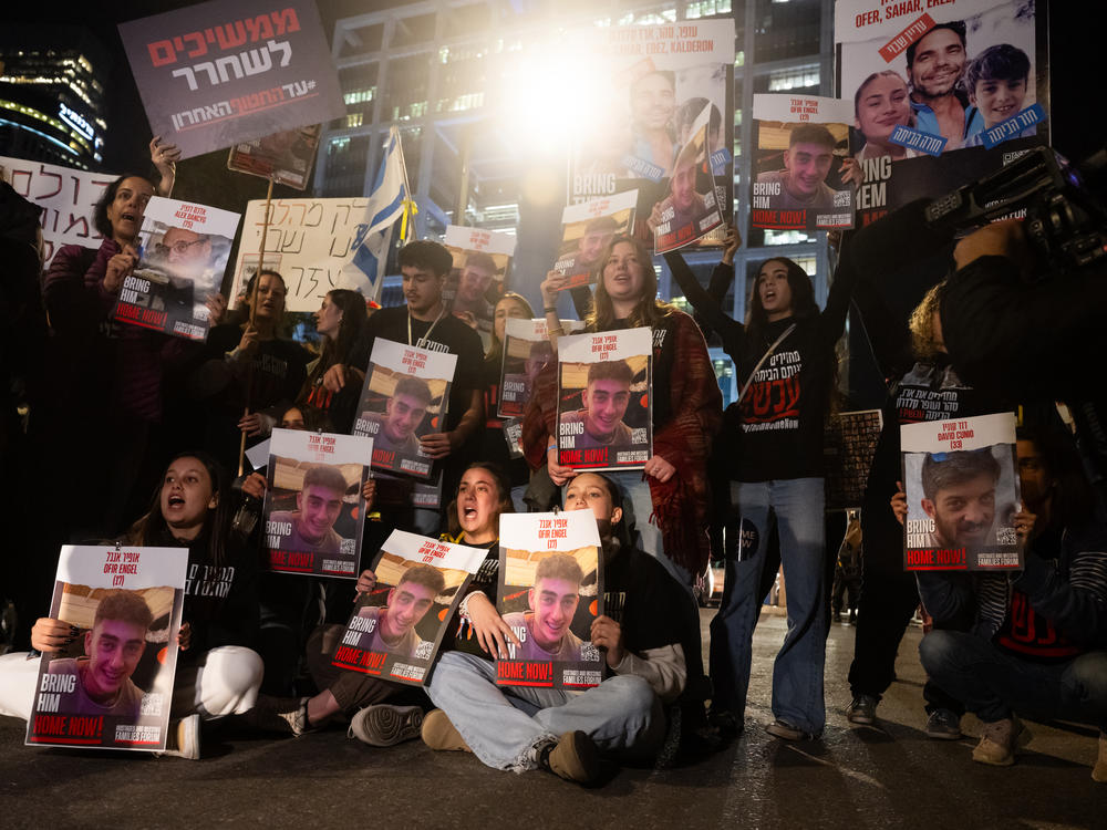 Families of the hostages, and their supporters, call for the release of all the hostages during a demonstration outside The Kirya ahead of the war cabinet meeting on the fifth day of the temporary truce on Tuesday in Tel Aviv, Israel.