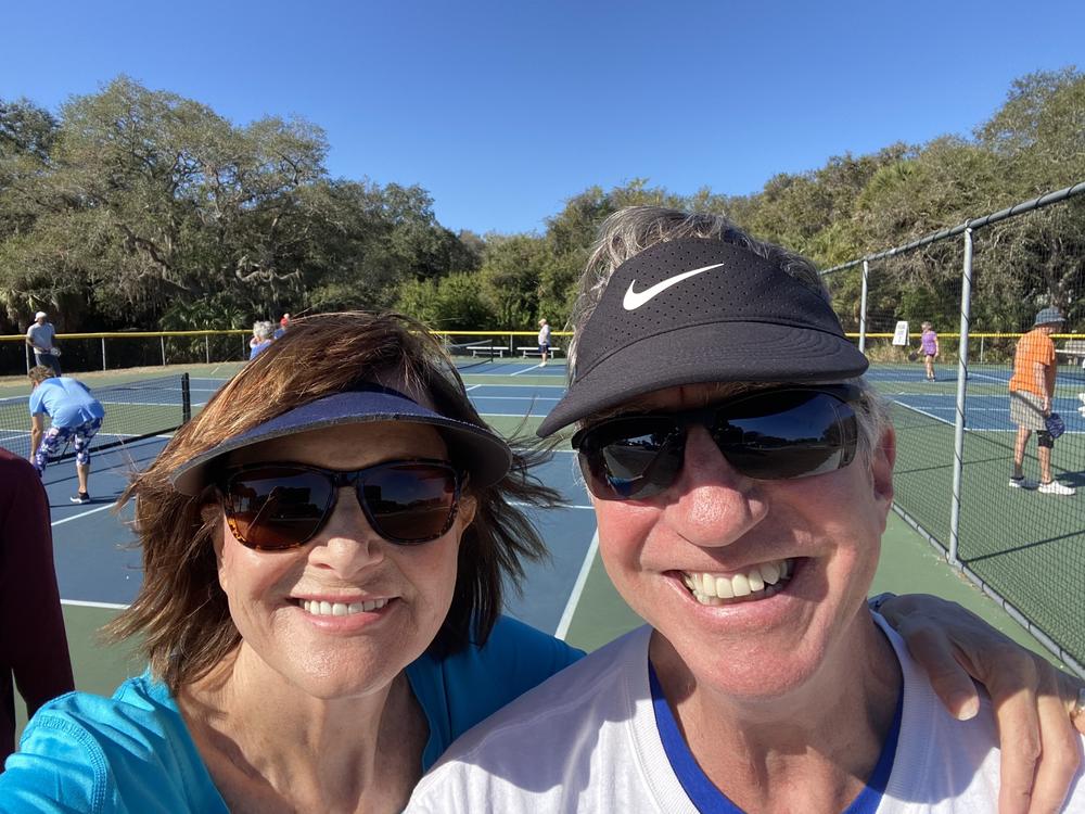 Debbie and her husband on the pickleball court.
