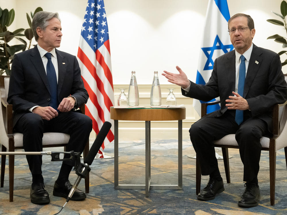 U.S. Secretary of State Antony Blinken, left, and Israel's President Isaac Herzog meet in Tel Aviv, Israel, on Thursday following the announcement of an extension of the truce between Israel and Hamas just before it was due to expire.