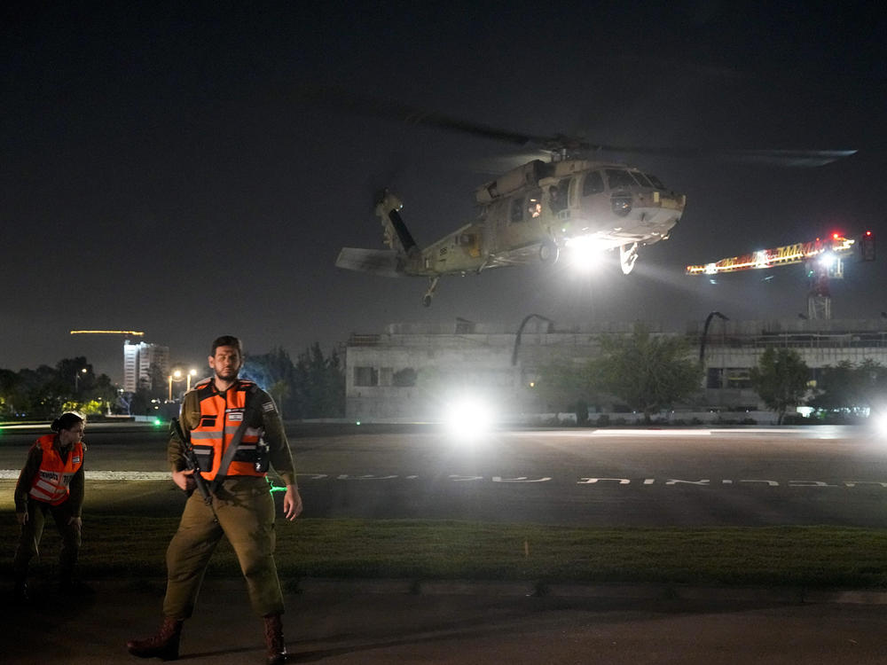 An Israeli Air Force helicopter carrying an Israeli hostage released by Hamas lands at the Sheba Medical Center in Ramat Gan, Israel, Thursday, Nov. 30, 2023.