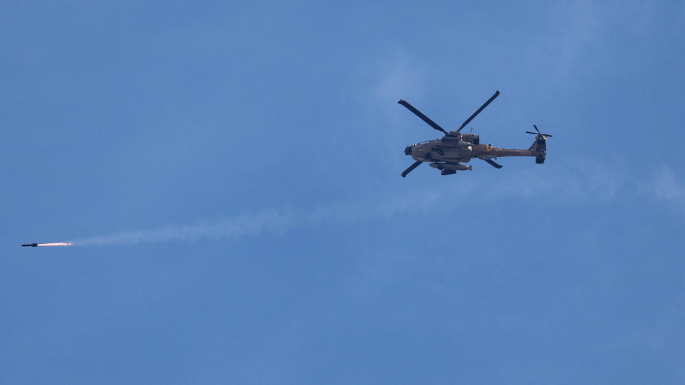 A photo taken from southern Israel near the border with the Gaza Strip on Monday shows an Israeli air force attack helicopter firing a missile.