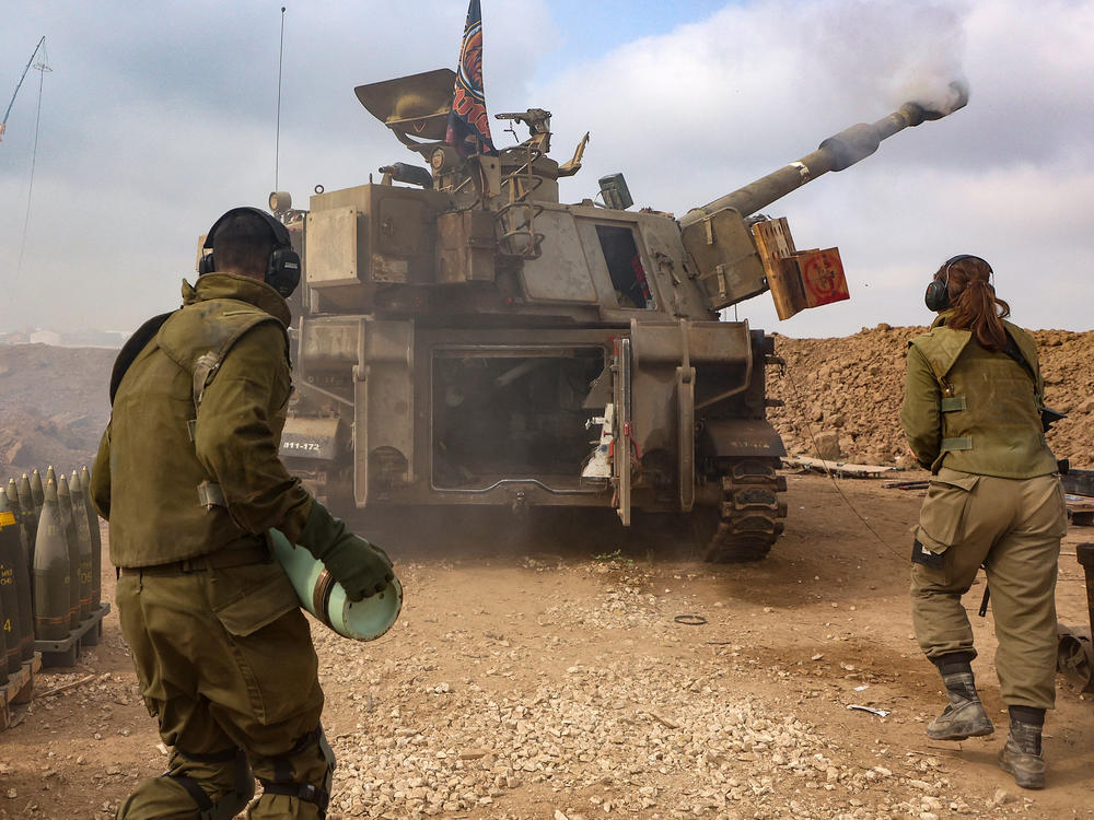 An Israeli artillery unit is pictured near the border with the Gaza Strip on Tuesday, amid continuing battles between Israel and the militant group Hamas.