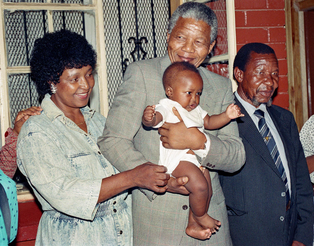 Anti-apartheid leader and his wife Winnie play with their grandchild Bambata. Mandela's oldest grandchild, Ndileka, is an activist who's calling for an end to what she refers to as 