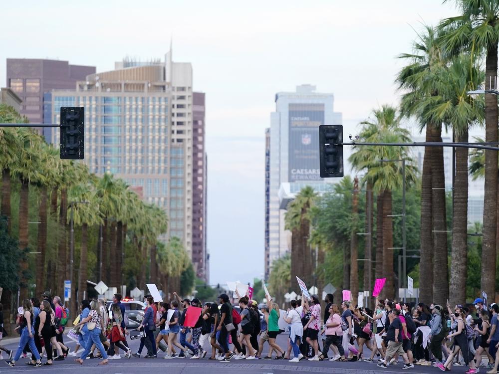 Protesters marched in Phoenix, Ariz., when the U.S. Supreme Court overturned Roe vs. Wade in 2022. This week, the state Supreme Court will determine which of two abortion bans will be enforced in Ariz.