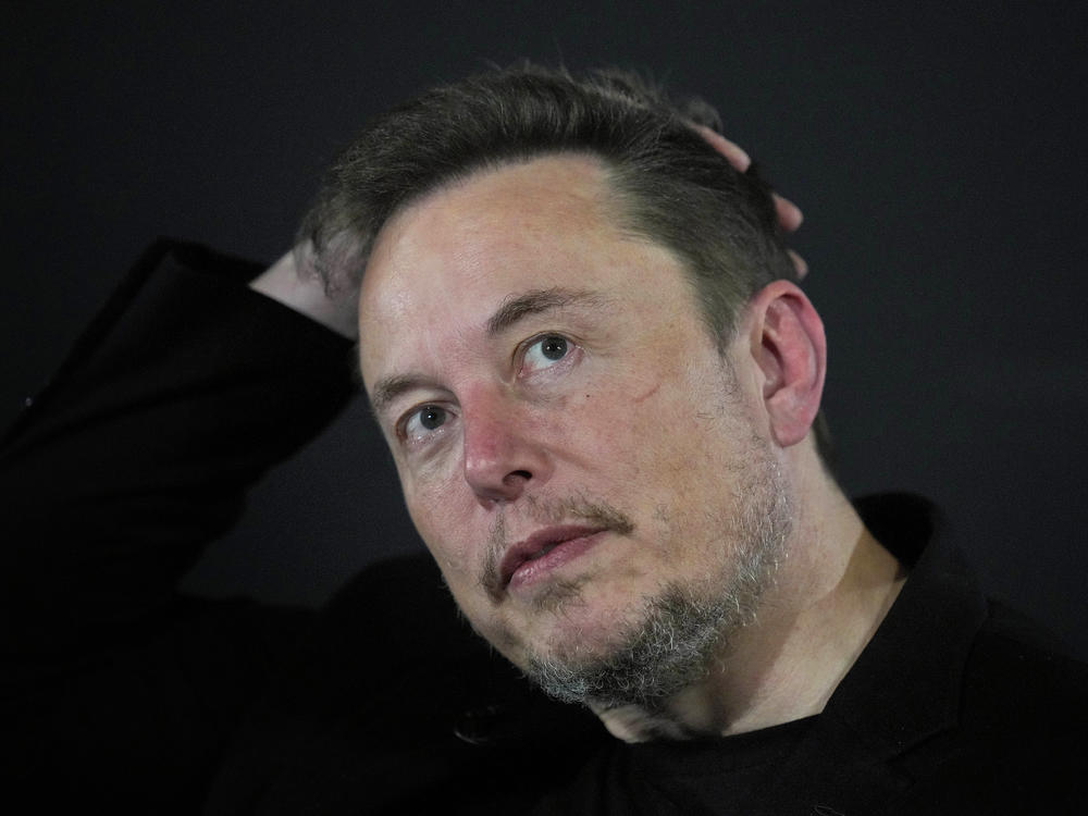Elon Musk reacts during an in-conversation event with Britain's Prime Minister Rishi Sunak in London, on Nov. 2, 2023.
