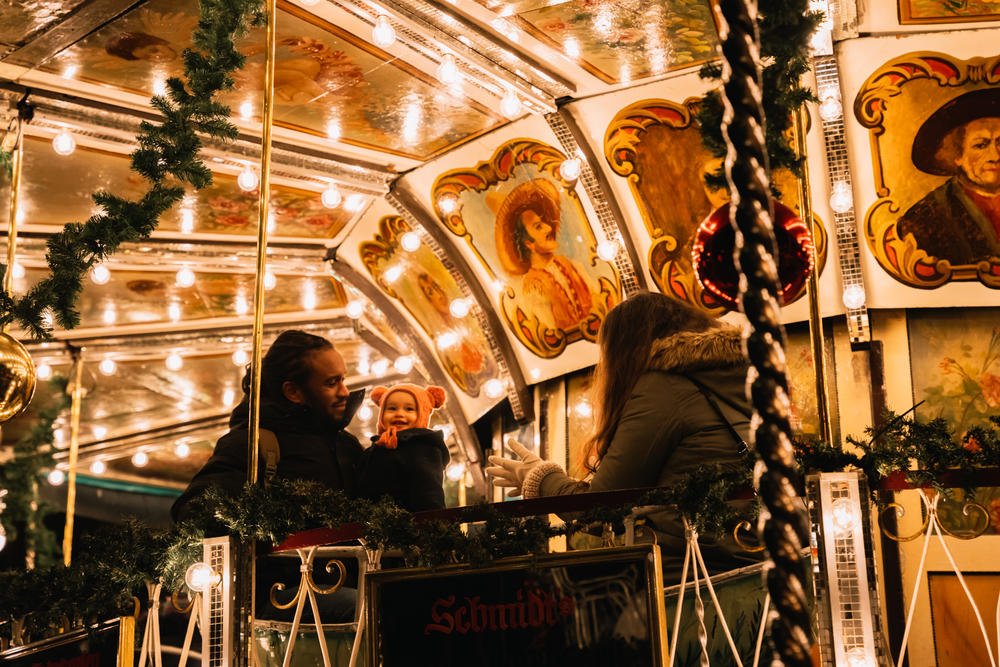Kurt Panton with his wife, Lizzy, and daughter, Pauline, at the Christmas market in Mannheim, Germany. He recently had his remaining student loans forgiven after 20 years in repayment.