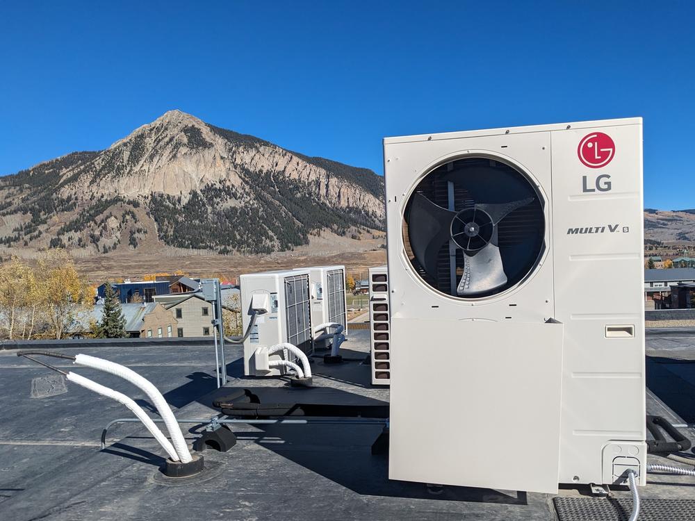 A heat pump atop a building in Crested Butte, Colo. The mountain town was the state's first community to ban natural gas in new construction.
