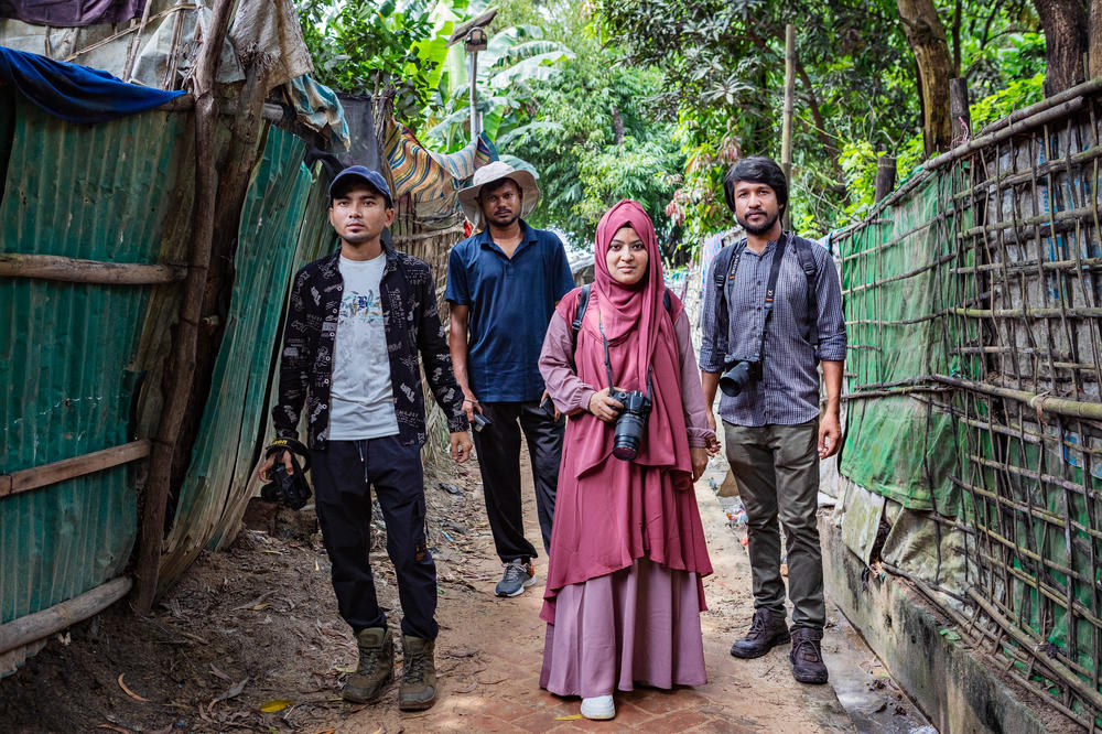 These are the four photographers from the Rohingya refugee community who were 2023 UNHCR Nansen Refugee Award Regional Winners for Asia and the Pacific. Left to right: Sahat Zia Hero, 29; Mohammed Salim Khan, 31; Shahida Win, 27; and Abdullah Habib, 29. They are pictured in the Kutupalong refugee settlement in Cox's Bazar, Bangladesh.
