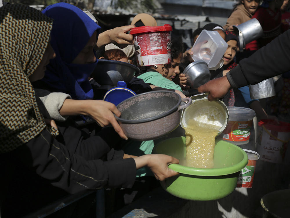 Palestinians line up for a meal in Rafah on Wednesday.