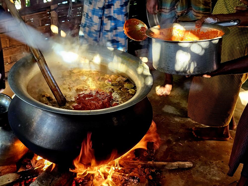 Rohingya in the refugee camp cook meat for <em>Jalsa</em>, a traditional gathering to raise donations for the mosque at the start of each winter.