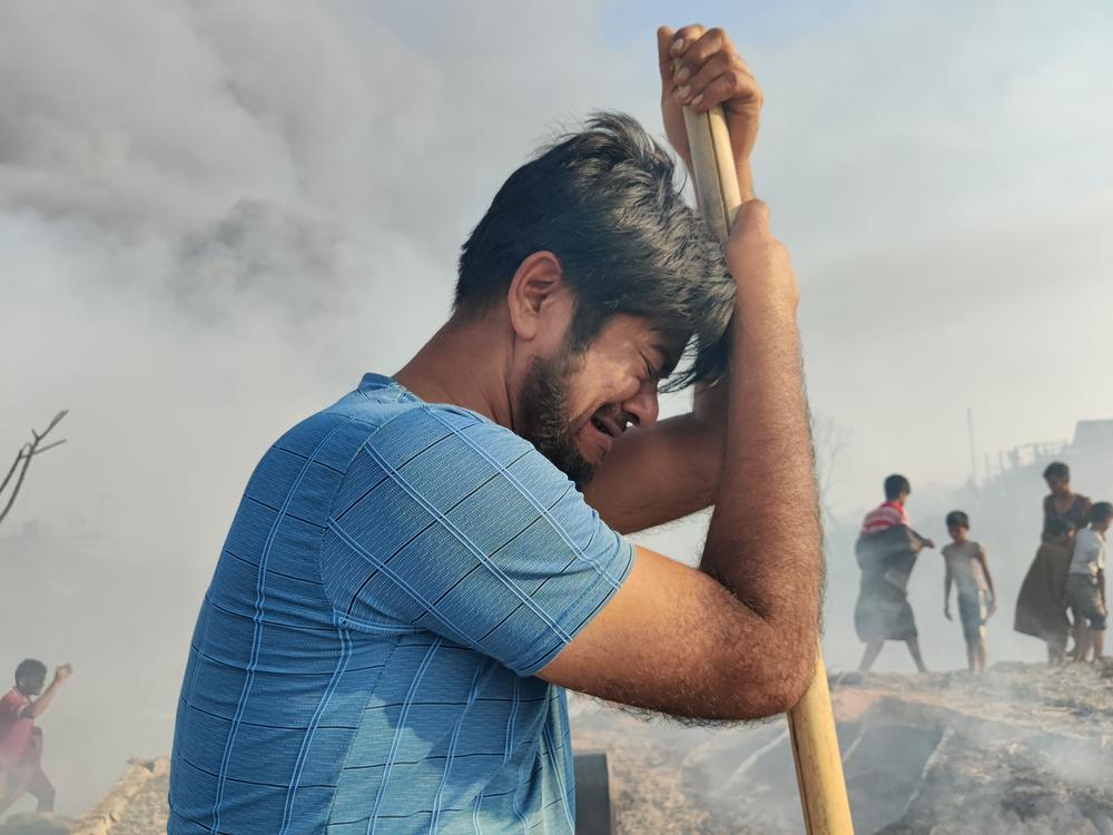 Zomir Hussain, a Rohingya refugee and father of 6, weeps after a devastating fire in March 2023 destroyed thousands of homes in the camp. Hussain says he lost all of his family's possessions. 