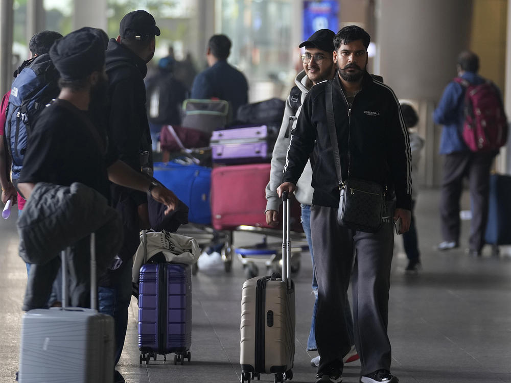 Indian passengers who travelled in an unmarked Legend Airlines A340 from Vatry Airport in France, arrive at the Chhatrapati Shivaji Maharaj International Airport in Mumbai, India, Tuesday, Dec. 26, 2023.