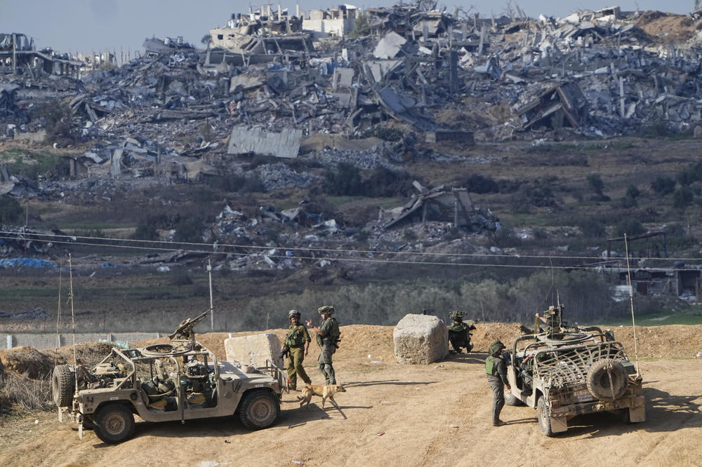 Israeli soldiers take up positions near the Gaza Strip border, in southern Israel, on Friday.