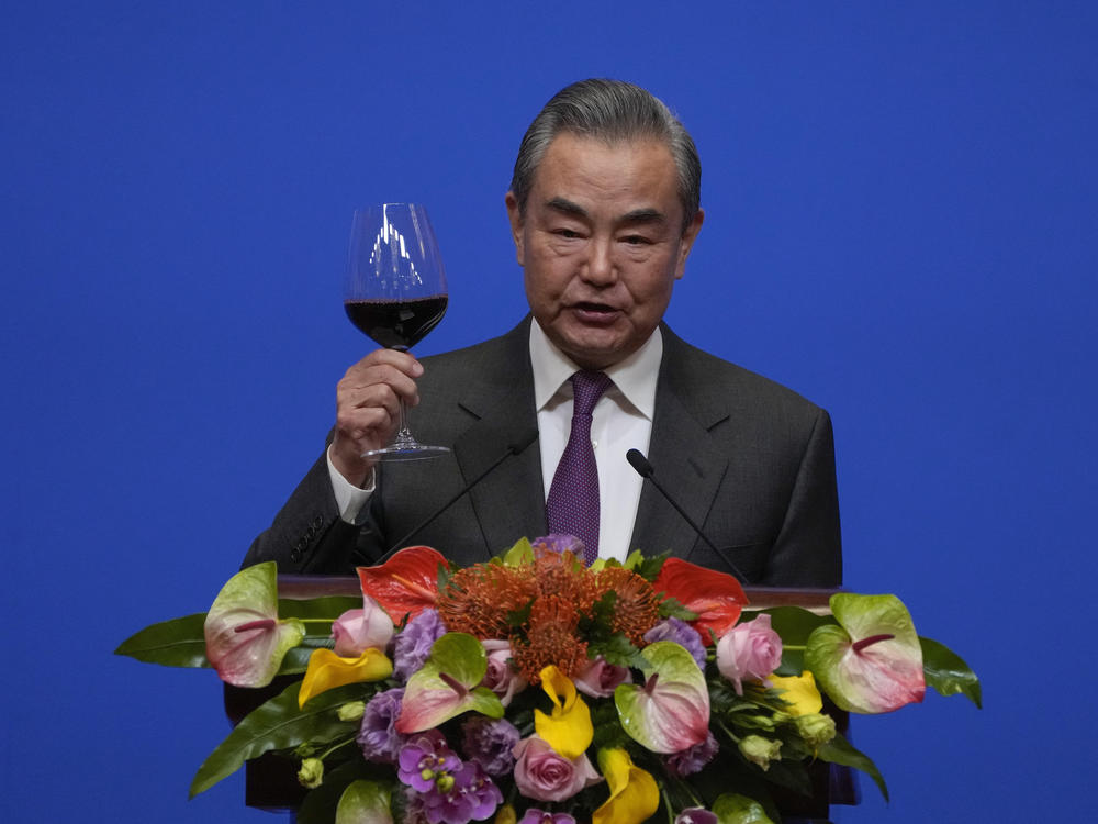 Chinese Foreign Minister Wang Yi gives a toast to invited guests after delivering a speech at a reception for Commemoration of the 45th Anniversary of China-U.S. Diplomatic Relations in Beijing on Friday.