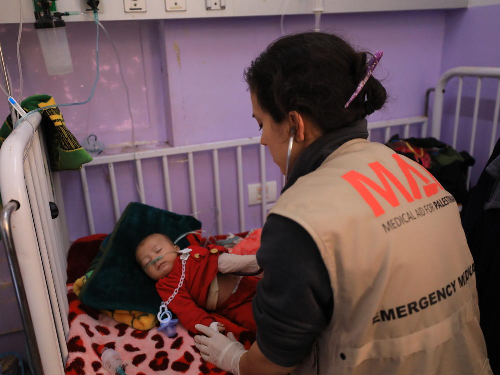Dr. Seema Jilani treats a baby at al-Aqsa hospital in Gaza.