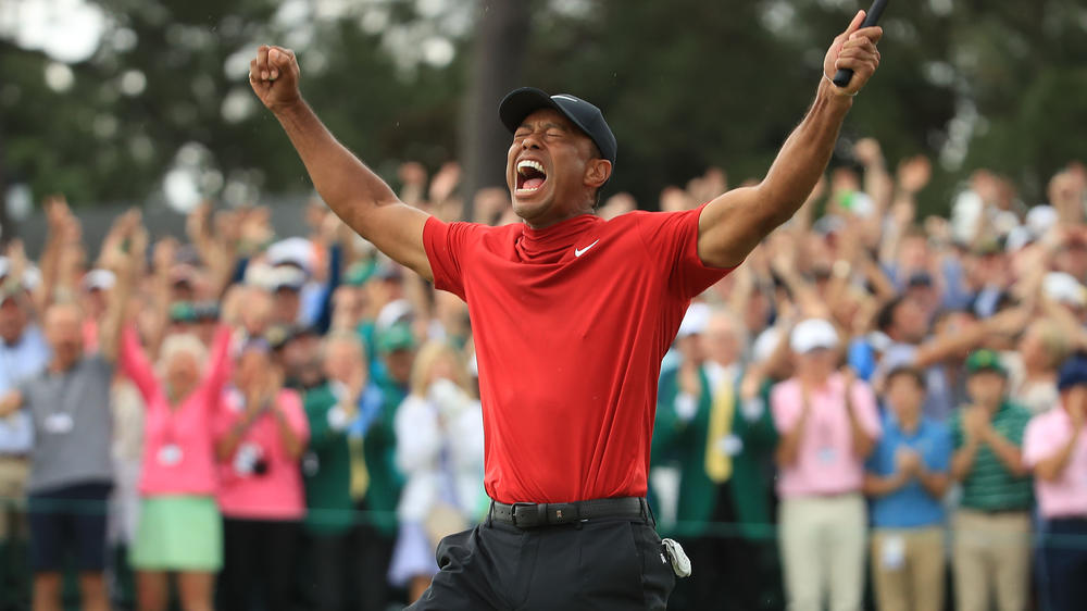 Tiger Woods celebrates on the 18th green after winning the Masters at Augusta National Golf Club on April 14, 2019 in Augusta, Georgia.